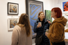 women looking at artwork