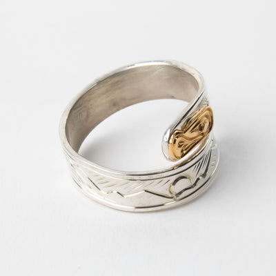 Hand carved 14k gold and silver eagle wrap ring with mountains carved by Indigenous Canadian Artist Agnes Seaweed Wisden