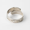 Hand carved 14k gold and silver raven wrap ring with mountains carved by Indigenous Canadian Artist Agnes Seaweed Wisden