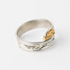 Hand carved 14k gold and silver raven wrap ring with mountains carved by Indigenous Canadian Artist Agnes Seaweed Wisden