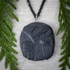 Argillite Thunderbird Pendant by Melanie Russ local Haida artist in a room set up