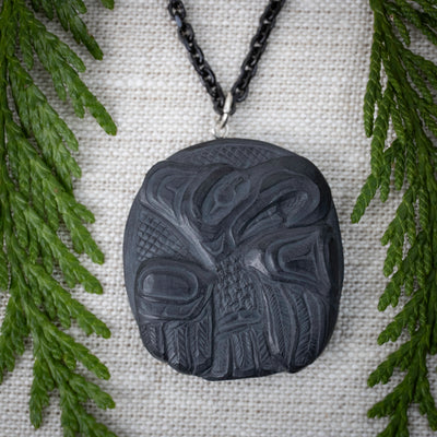 Argillite Thunderbird Pendant by Melanie Russ local Haida artist in a room set up