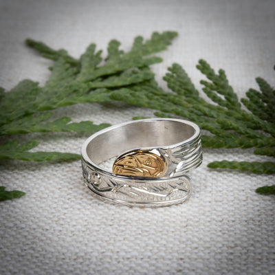 Hand carved 14k gold and silver raven wrap ring with mountains carved by Indigenous Canadian Artist Agnes Seaweed Wisden